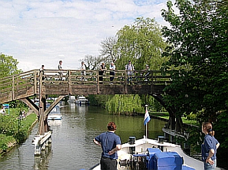 Shooting a bridge aboard the Thames river barge Magna Carta