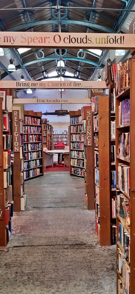 Shelves of Books, Quotes, Murals, and Railway Paraphernalia at Barter Books © essentially-england.com
