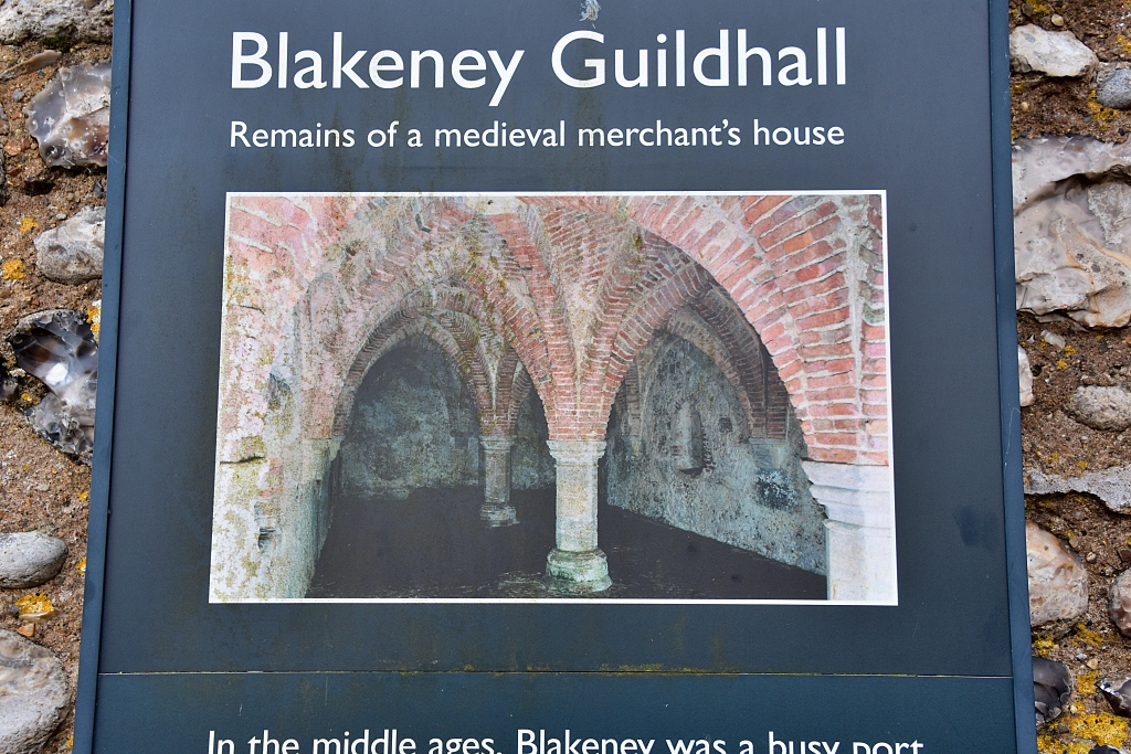 Photo of English Heritage Sign Outside Blakeney Guildhall Showing the Undercroft © essentially-england.com