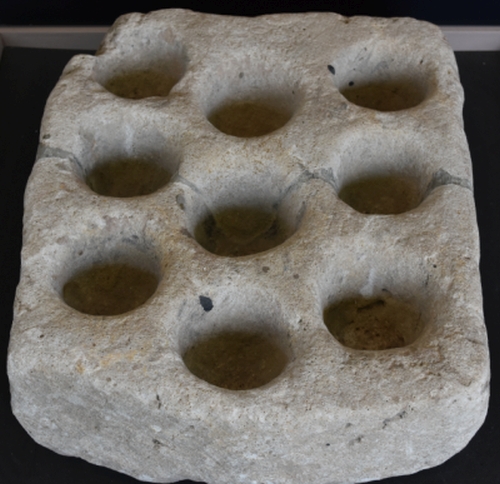 Cresset stone lamp probably used in the dormitory of Haughmond Abbey in Shropshire &copy; essentially-england.com