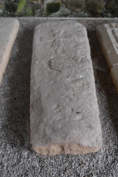 Tombstone stored in the Chapter House of Haughmond Abbey in Shropshire © essentially-england.com