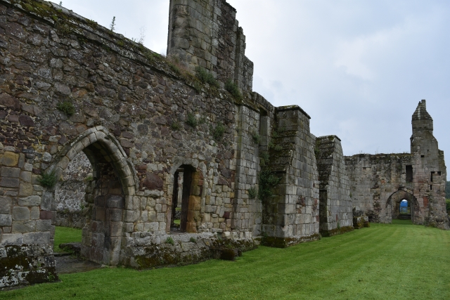 View along the great western wall towards the impressive abbots hall of Haughmond Abbey in Shropshire &copy; essentially-england.com