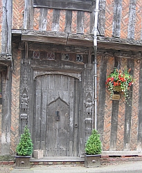 Lavenham: carved door of de Vere House © essentially-england.com