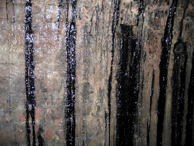 Seeping tar inside the Tar Tunnel, part of the Ironbridge Gorge World Heritage Site in Shropshire.