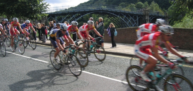 The Tour of Britain Cycle Race Flashes Through Ironbridge © essentially-england.com