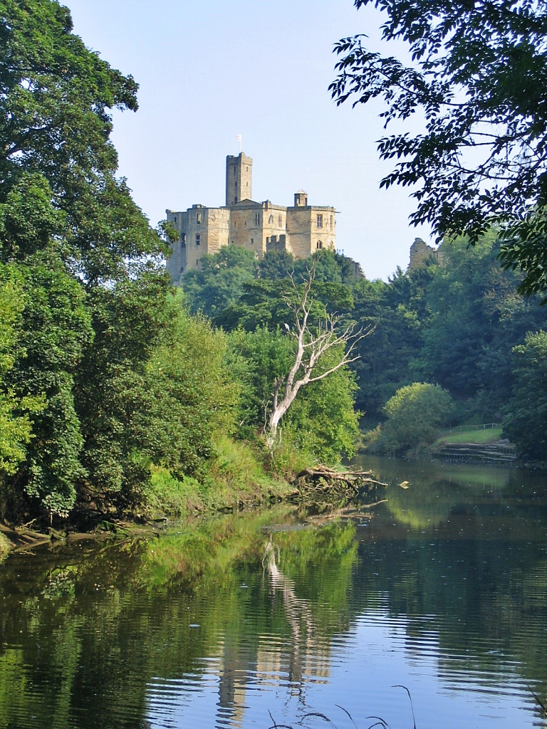 Warkworth Castle from the Bank of The River Coquet  © essentially-england.com