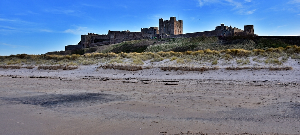 Bamburgh Castle from the Beach © essentially-england.com