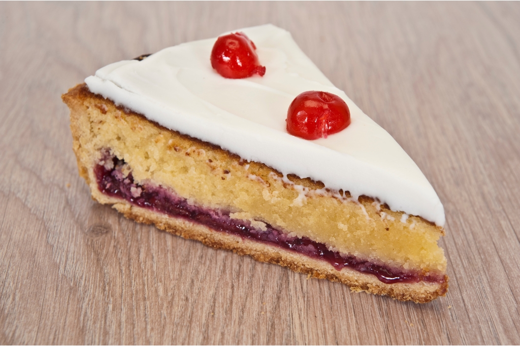 Slice of Cherry Bakewell Tart © MarkGillow | Getty Images canva.com