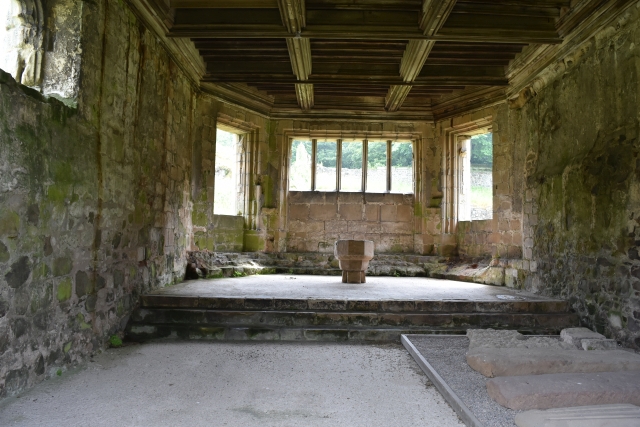 The inside of the Chapter House of Haughmond Abbey in Shropshire contains the font and some tombstones from the abbey church &copy; essentially-england.com