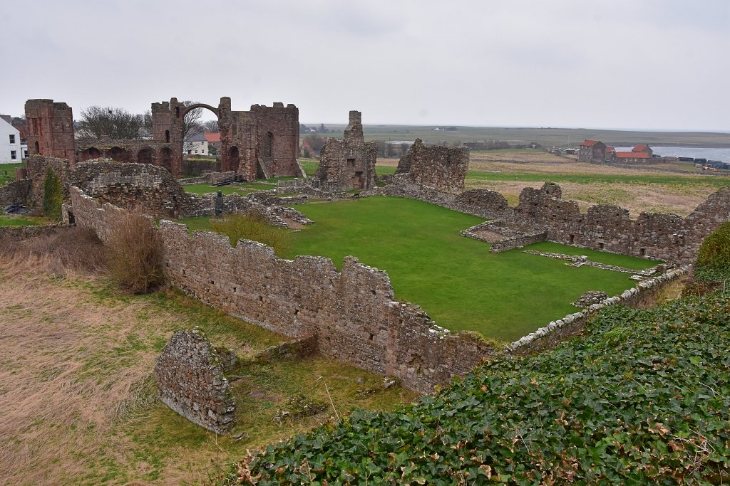 Lindisfarne Priory Ruins from the Heugh © essentially-england.com