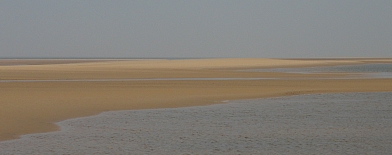 Land and sea blend on a Norfolk beach © essentially-england.com