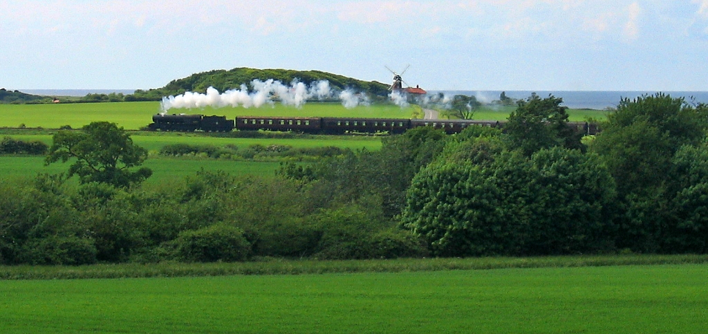 Steam Train Passing Weyboune Windmill on the North Norfolk Railway