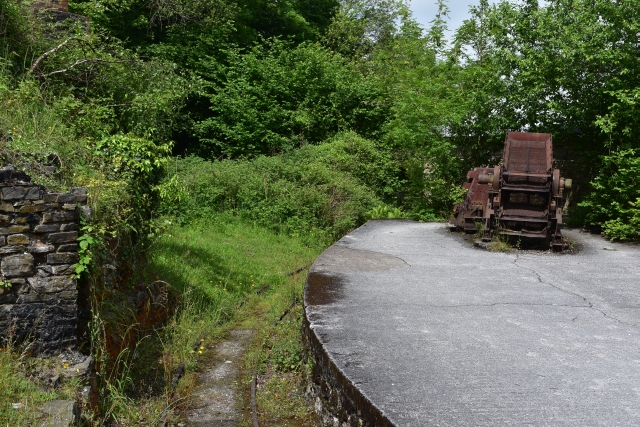 sdr railway platform and rusting mineral grading tools at snailbeach mine in shropshire