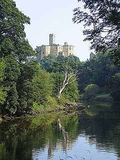Warkworth Castle from the River Coquet © essentially-england.com