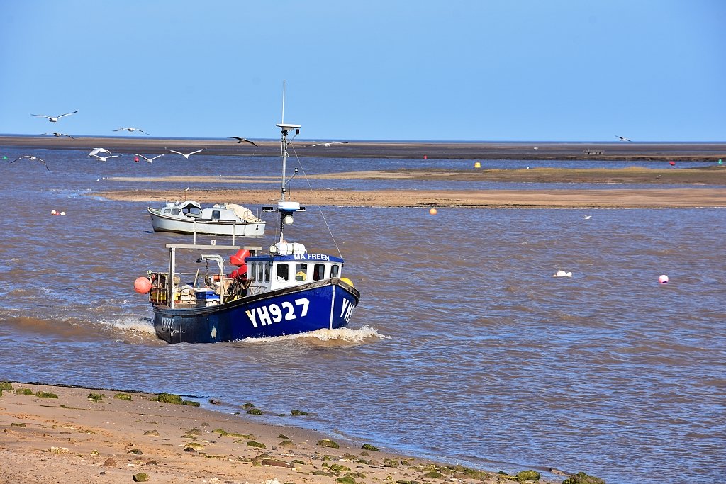 Fishing Boat Approaching Wells-next-the-Sea © essentially-england.com